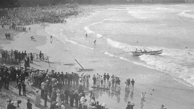 Members of the Sly family launching a whaleboat at Manly during a surf carnival. Picture Northern Beaches Library