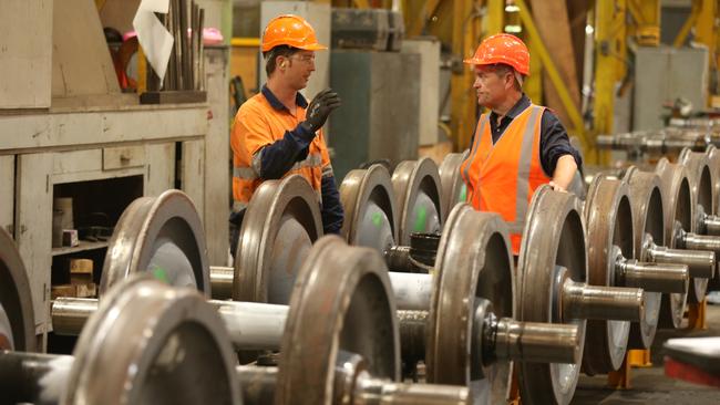 Federal Labor Opposition Leader Bill Shorten talks with fitter and turner Josh Guan at the Downer railway workshop in Maryborough. Picture: Lyndon Mechielsen/The Australian