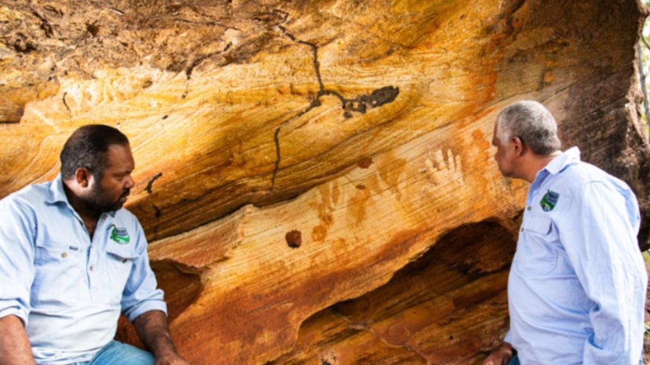 Vince and Clifford Harrigan at one of the rock art sites at Normanby Station. Photo: Annette Ruzicka.