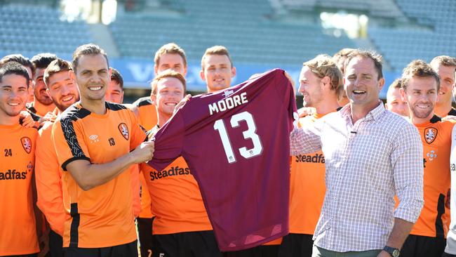 Queensland rugby league legend Billy Moore and Roar captain Jade North with the maroon jersey. Picture: Annette Dew