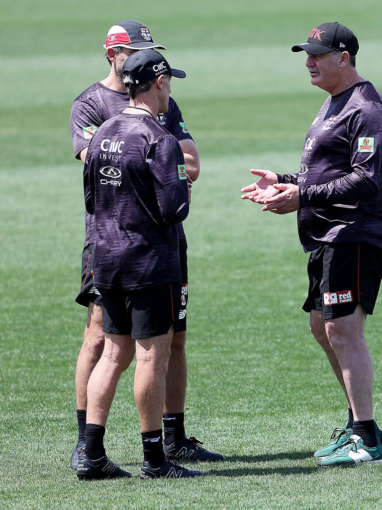 Coach Ross Lyon consulting assistant coaches at training ahead of the Christmas break. Picture: Ian Currie