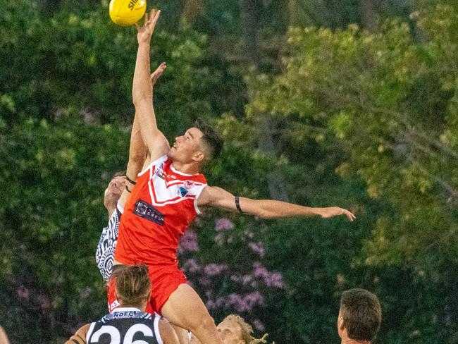 Waratah big man Ned Stevens jumps over the pack and Palmerston opponent Matt Dennis to give his side first use of the ball. Picture: Aaron Black/AFLNT Media