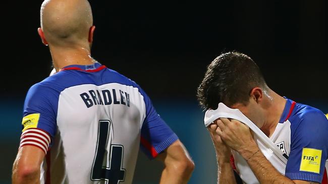 Michael Bradley and Christian Pulisic of the US team react to their loss against Trinidad and Tobago at the Ato Boldon Stadium.