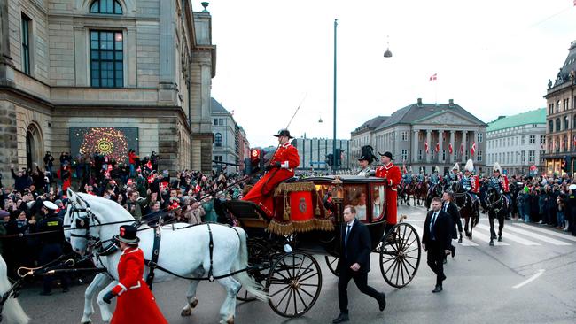 King Frederik X of Denmark and Queen Mary of Denmark wave from a carriage during a ride back to the Amalienborg Castle in Copenhagen, Denmark, on January 14, 2024. Picture: Nicolai Lorenzen / Ritzau Scanpix / AFP / Denmark