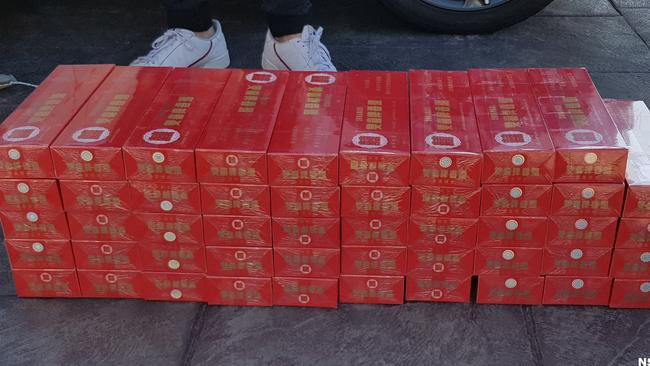 Police allegedly seized 325 boxes of illegally imported tobacco from a Seven Hills home. Picture: NSW Police