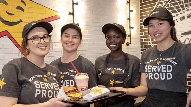 Carl’s Jr staff Alicia Firth, Jacinta Chidgey, Nyaduoth Galuak and Cassidy McLaren serve up. Picture: Andy Brownbill