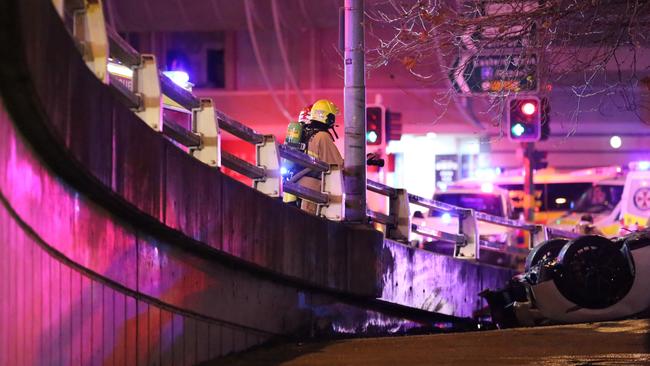 The car appeared to have hit a guard rail near the Novotel Hotel before catching fire. Picture: Steve Tyson