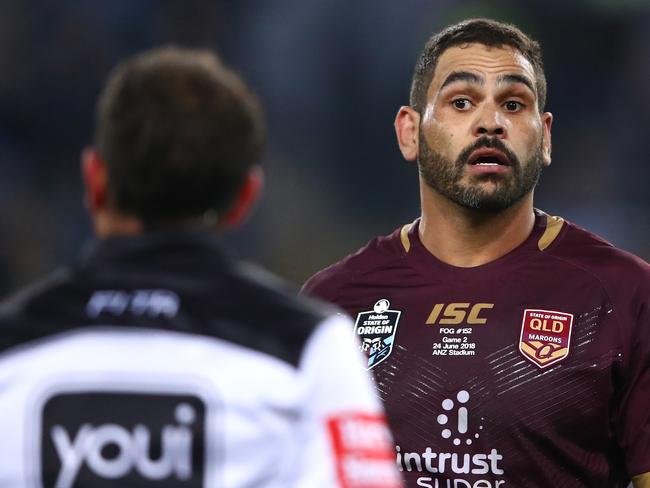 Greg Inglis of Queensland talks to referee Gerard Sutton during Game 2 of the State of Origin series. Picture: Cameron Spencer/Getty Images