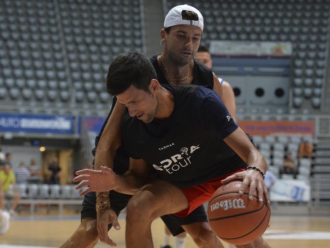 Bulgarian tennis player Grigor Dimitrov, rear, plays basketball with Serbia's Novak Djokovic in Zadar, Croatia last week. Dimitrov has since tested positive for coronavirus