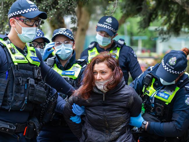 MELBOURNE, AUSTRALIA - NewsWire Photos - OCTOBER 16, 2021:   A Anti Lockdown protector detained by police in Princess Park. Picture: NCA NewsWire/Sarah Matray