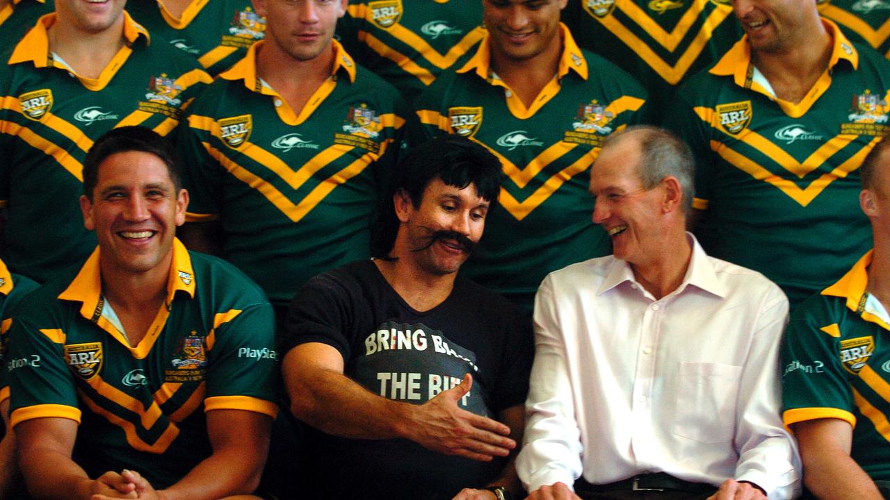 Reg Regan goes to shake coach Wayne Bennett’s hand. (AAP Image/Dave Hunt)