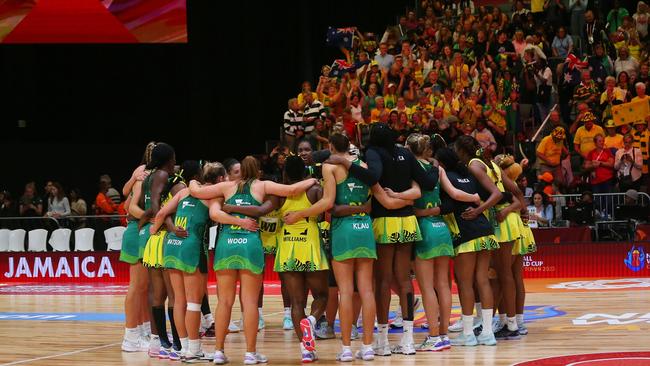 Australia and Jamaica huddle together after the game. Photo by Shaun Roy/Gallo Images/Netball World Cup 2023.