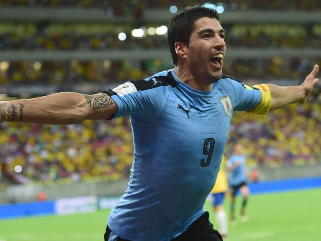 Controversial but brilliant: Luis Suarez celebrates scoring for Uruguay.