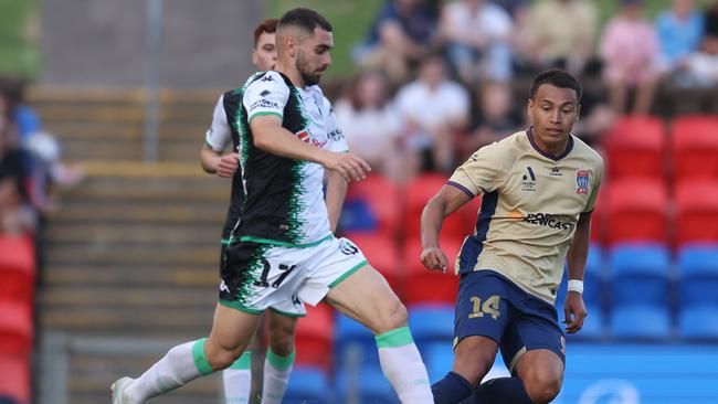 Western United’s Benjamin Garuccio is challenged during the December 30 match against the Newcastle Jets. Picture: Getty Images