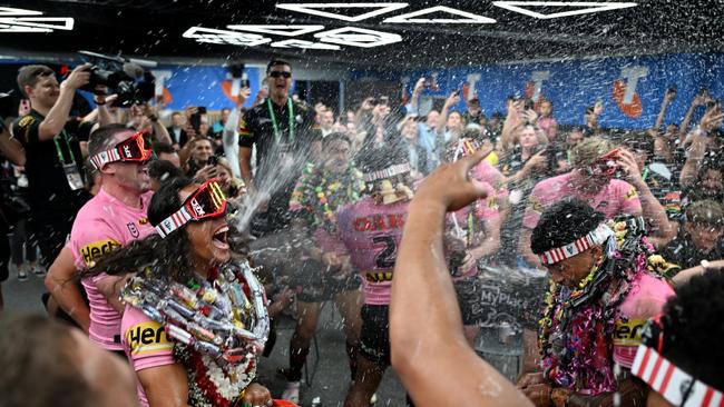 And leads the celebrations in the change room. Picture: NRL Photos