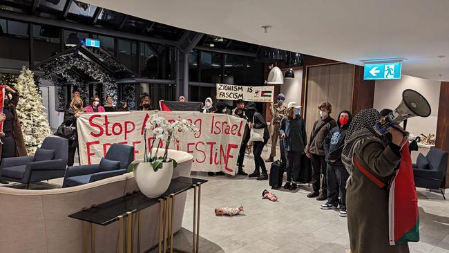 Pro-Palestinian activists have sparked outrage after they ambushed visiting friends and families of Israeli hostages at the Melbourne hotel they were staying at.