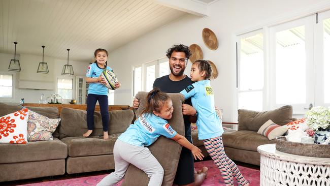 Tackling practice: Karmichael Hunt plays with his daughters Halo 8, Gigi 6 and Bodhi 5. Picture: Tim Hunter.