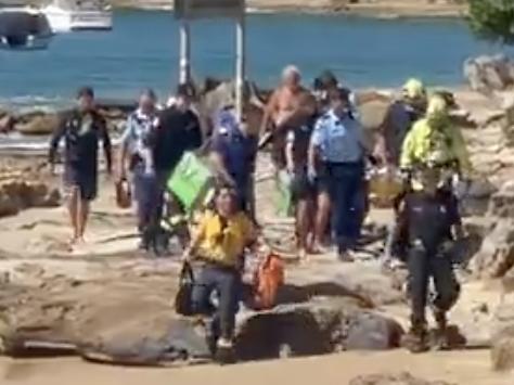 A woman has been rushed to hospital after being bitten by a shark at Gunyah Beach, near Bundeena, in Port Hacking NSW.