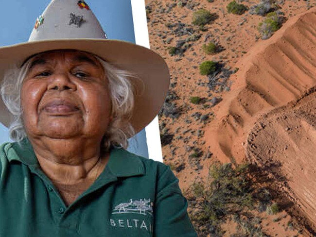 Beverley Patterson holding sacred upturned soil next to a borrow pit along the Hawker Graded Track. Pictured on September 15th 2023. Picture: Ben Clark