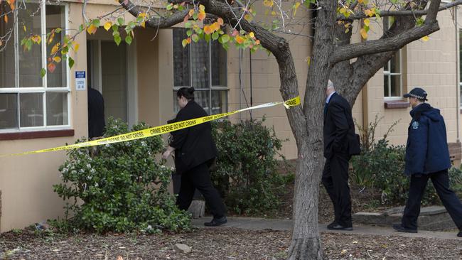 SA Police detectives and forensic examiners enter a Gilberton block of flats after the death of a 63-year-old man. Pictures: Emma Brasier