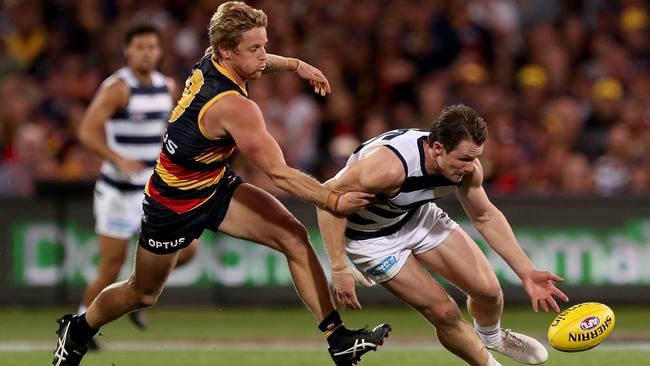 ADELAIDE, AUSTRALIA - APRIL 04: Rory Sloane of the Crows tackles Patrick Dangerfield of the Cats during the 2019 AFL round 03 match between the Adelaide Crows and the Geelong Cats at Adelaide Oval on April 04, 2019 in Adelaide, Australia. (Photo by James Elsby/AFL Photos/Getty Images)