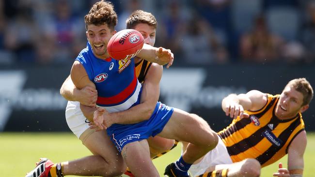 BALLARAT, AUSTRALIA - MARCH 03: Tom Liberatore of the Bulldogs is tackled during the AFL match between the Western Bulldogs and the Hawthorn. (Photo by Scott Barbour/Getty Images)