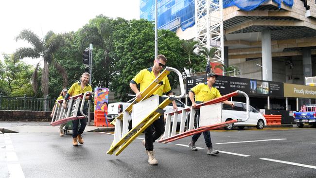 Workers leaving the 443 Queen St site on February 24. Picture: NCA NewsWire / Dan Peled