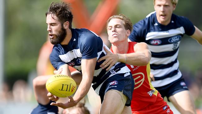 James Parsons gets a handball off under pressure. Picture: Alix Sweeney