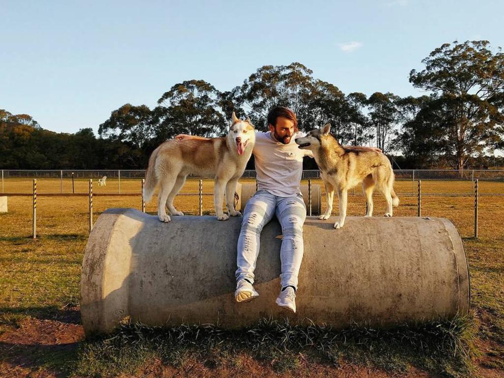 Adrian Fowler and his two Huskies, Sabre and Lunakai. Picture: Instagram/Adrian__Fowler