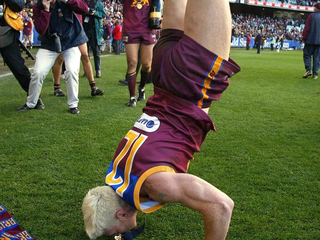 Aker performing a handstand after the 2003 Grand Final.