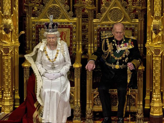 Queen Elizabeth II sits next to Prince Philip in the House of Lords as she waits to read the Queen's speech to politicians in London. Picture: AP