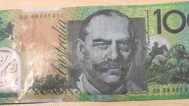 Police hunting a man and woman after a fake $100 bill was cashed at ...