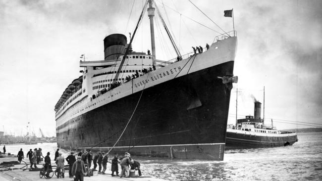 A tug pushes the ocean liner Queen Elizabeth to the dock at Southhampton in 1946.