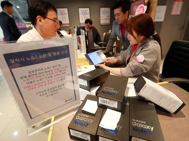 Not an ideal scene for any company: Customers return their Samsung Note 7 mobile phones at a dealership in Seoul on October 13. Picture: AFP/Yonhap