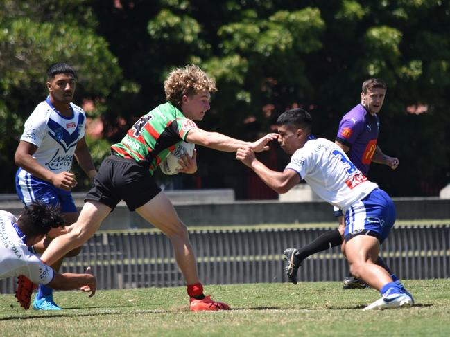 Charlie Poynton is tackled by Chris-Jaiden Alaelua. Picture: Sean Teuma/NewsLocal