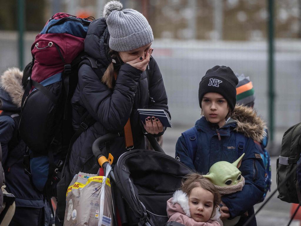 Refugees from Ukraine cross the Ukrainian-Polish border in Korczowa. Picture: AFP