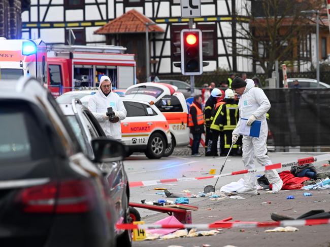 Forensic police officers close to the site of the car ramming. Picture: AFP