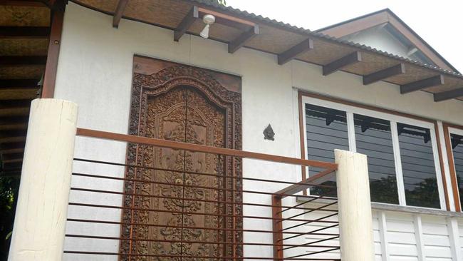 Carved doors and seagrass under the extended eaves at Asia House. Picture: Jann Houley