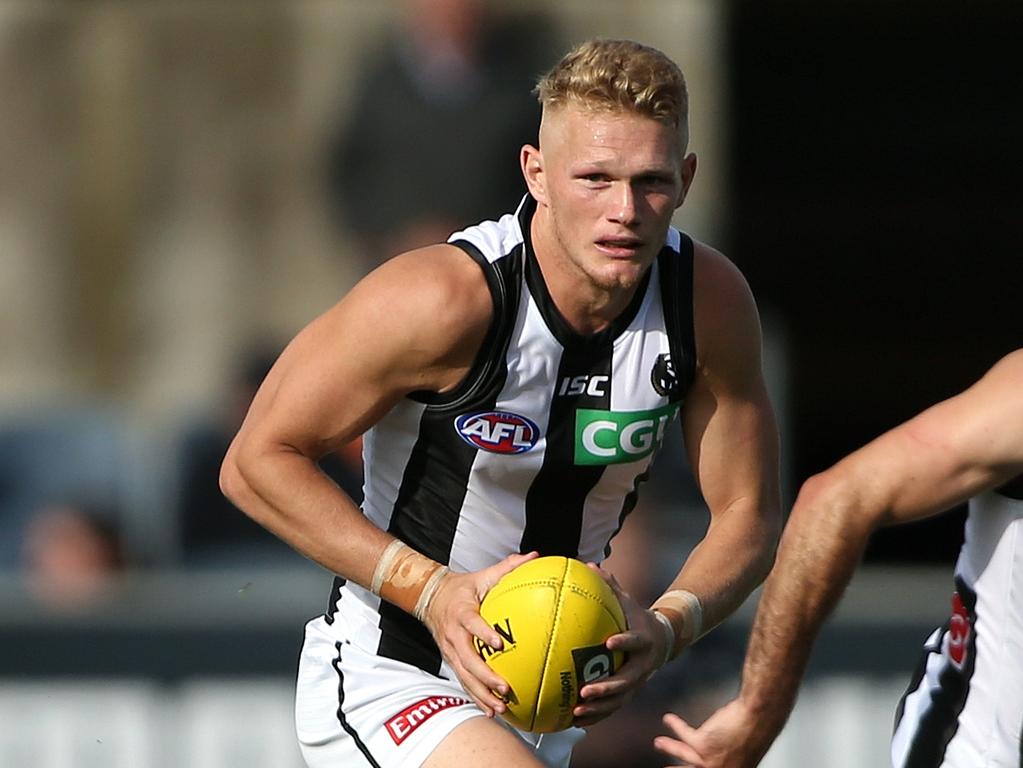 Adam Treloar has been caught in the middle.