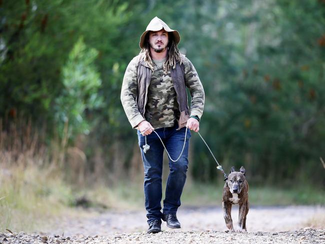 Jake Cassar, with his dog Benson, from Kariong, went on a quest in 2015 to capture the Central Coast's infamous black panther. Picture: Peter Clark