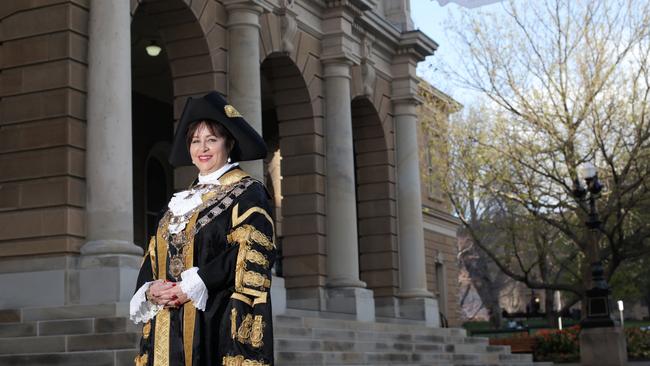 Former Lord Mayor Sue Hickey in front of Town Hall in the robes and hat that come with the office. Picture: LUKE BOWDEN