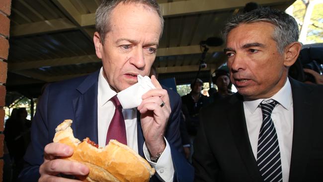 Opposition Leader Bill Shorten on election day. The origins of the sausage sandwich are unknown. Picture: Kym Smith