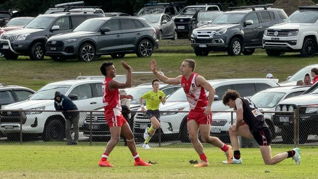 Shannon Gladman (middle) after kicking a great goal in the first quarter on Saturday.