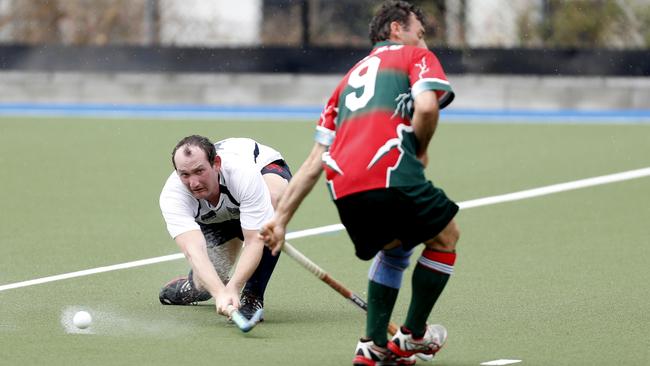 Mitchell Smith of Queensland Police and Emergency services side against Redcliffe Red Schwarz team during the Brett Forte memorial hockey match played at the Mary Nairn Fields, Redcliffe, Saturday, October 6, 2018. Picture: AAP/Regi Varghese