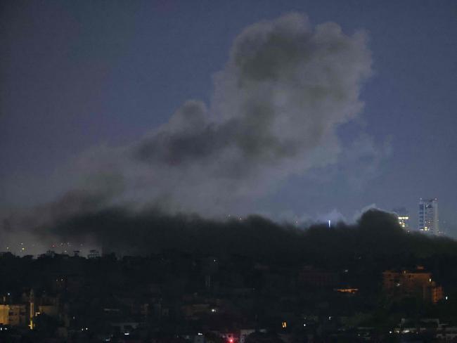 Smoke rises from the site of an Israeli airstrike that targeted a neighbourhood in Beirut on Friday. Picture: AFP