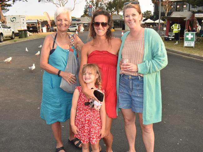 Patricia Mason, Macey, Patrice Mason and Erin Woodham at the San Remo Christmas Carols at the foreshore on Friday, December 20, 2024. Picture: Jack Colantuono