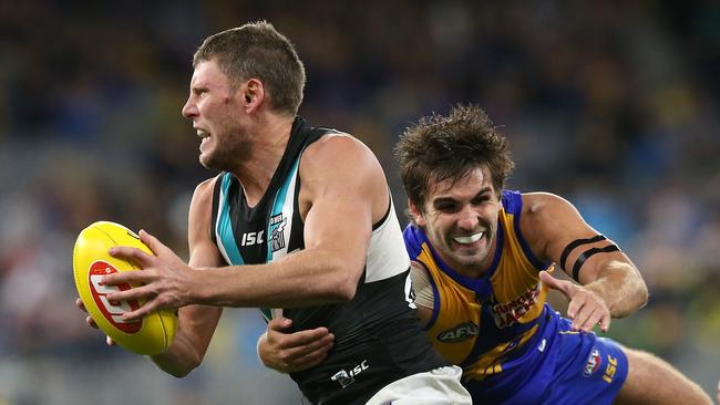 Brad Ebert of the Power looks to break from a tackle by Andrew Gaff of the Eagles during the round 5 AFL match between West Coast and Port Adelaide at Optus Stadium last year. Pic: Paul Kane/Getty Images