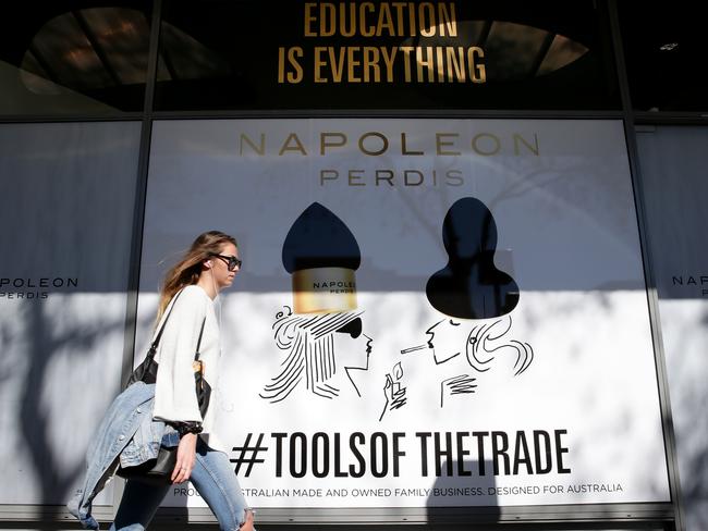 The Napoleon store in Double Bay has new shop artwork, showing a woman smoking below a sign saying "education is everything". Picture: Jonathan Ng