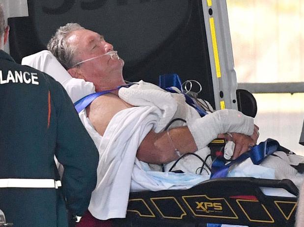 Shark attack victim arrives at RAH. Inset: Board bitten by shark