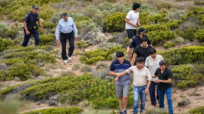 Family members waited on the nearby cliffs as the search for Arash Yari continued. Picture: AAP / Mike Burton